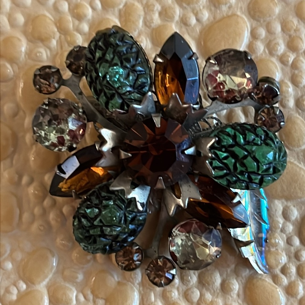Suspected Judy Lee brooch with green lava glass, spotted stones, iridescent leaf
